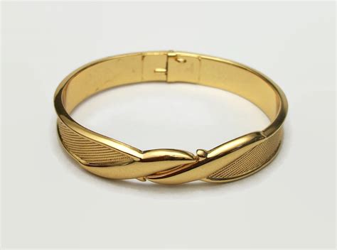 gold tone metal bangle bracelet.